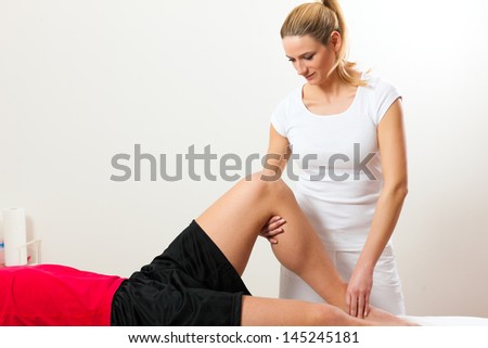 Patient at the physiotherapy doing physical exercises with his therapist Patient at the physiotherapy doing physical exercises with his therapist