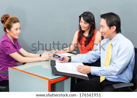 Job interview with an Asian candidate for an new office employment or negotiation for hiring