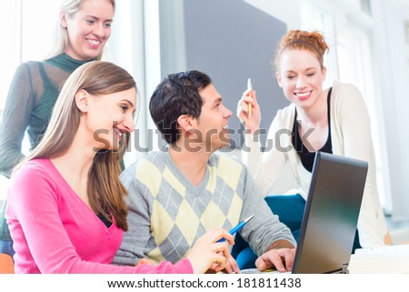Group of students learning at college with laptop computer