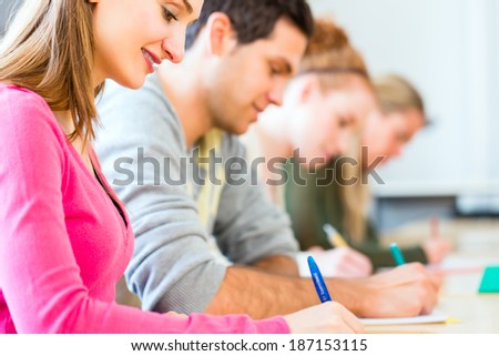 University college students writing test or exam