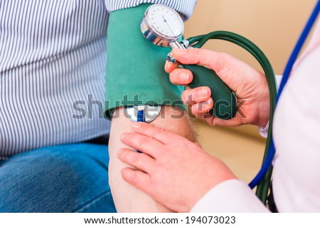 Woman controlling blood pressure with stethoscope and sleeve on arm of man