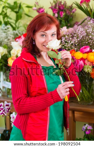 Florist selling flowers and bouquets in shop