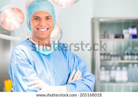Hospital - Young male doctor or surgeon in a sterile operating room, theater or clean room of clinic