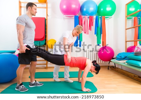 Patients at the physiotherapy doing physical exercises with therapist