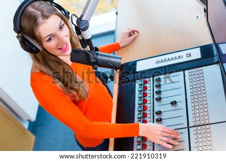 female Presenter in radio station hosting show for radio live in Studio