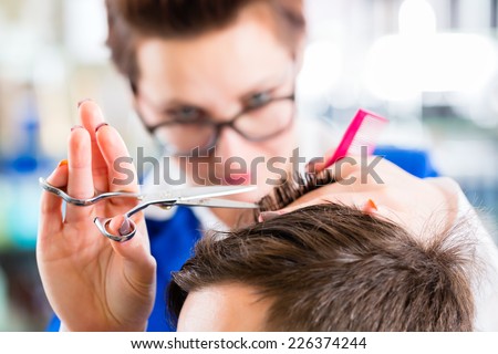 Female coiffeur cutting men hair in hairdresser shop