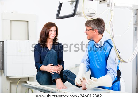 Orthopedist doctor making x-ray of patient leg in surgery