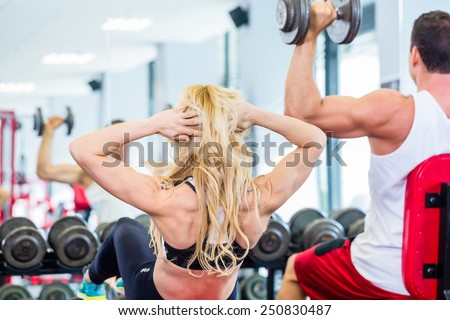 Fitness, exercise and woman with flat stomach at gym for training workout  for healthy weight management.