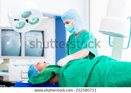 Orthopedic surgeon doctor operating patient in surgery or hospital