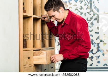 Korean man shopping cabinet in Asian furniture store