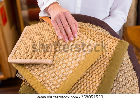 Interior Designer buying floor mats in home improvement store