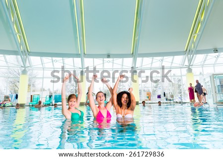 Women swimming in indoor public pool