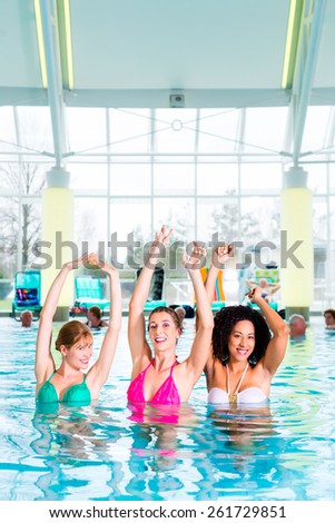 Women swimming in indoor public pool