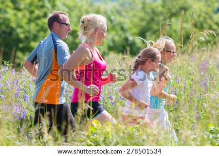 Family running for better fitness in summer through beautiful landscape