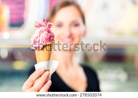 Sales girl portion a ball of ice cream to wafer