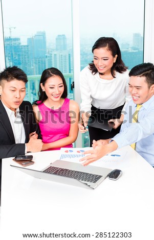 Asian banker team counseling client finance investment in bank office