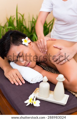 Indonesian Asian man in wellness beauty spa having aroma therapy massage with essential oil, looking relaxed