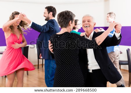 Group of people dancing in dance class having fun