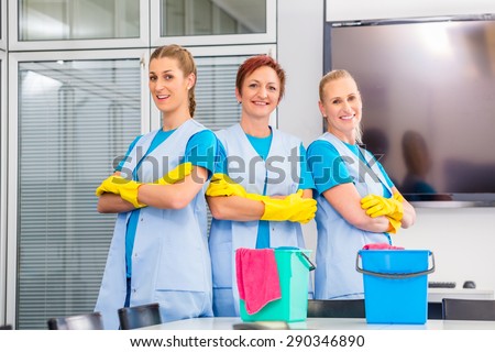 Cleaning brigade working in office