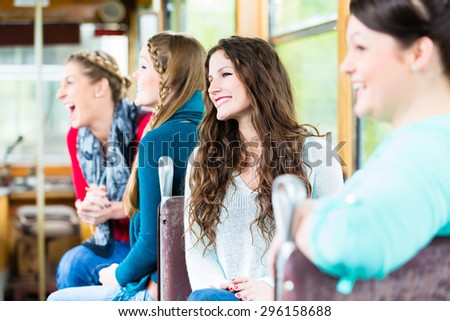 Group of people commuting in tram or cable car