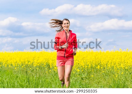 Woman running for better fitness in spring