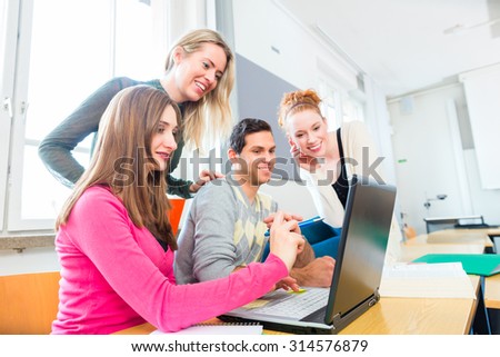 University college students using laptop for project team work learning