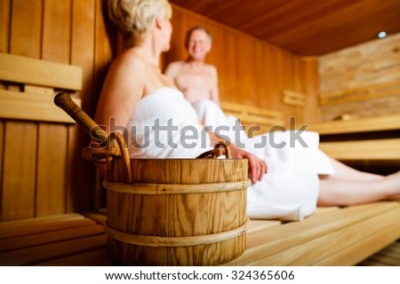 Seniors in sauna sweating and relaxing