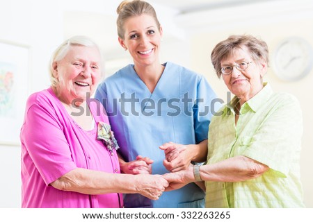 Elderly care nurse with two senior women