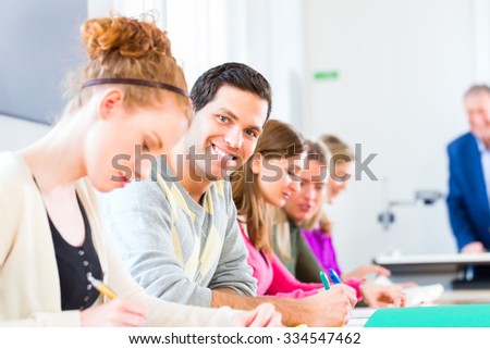 University college students having examination