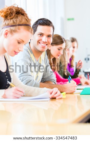 University college students having examination