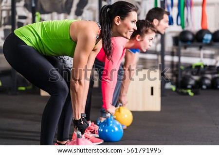 Functional fitness workout in sport gym with kettlebell