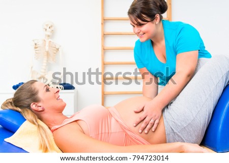 Pregnant woman at physical therapy on couch with terapist