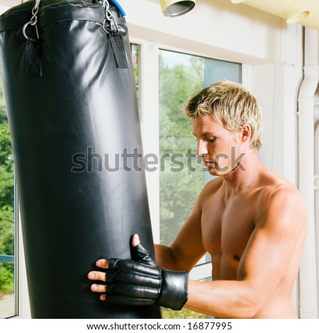 Kickboxer preparing the sandbag