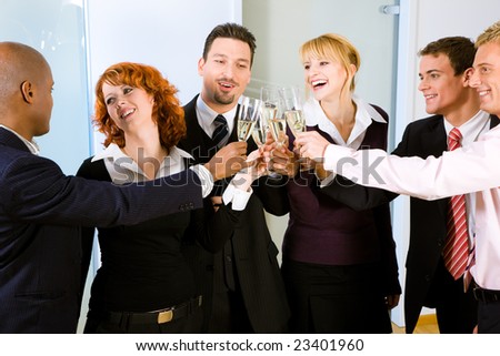 People at a reception at the point where the toast is being given