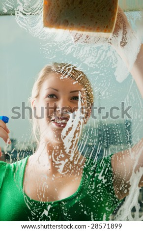 woman cleaning window