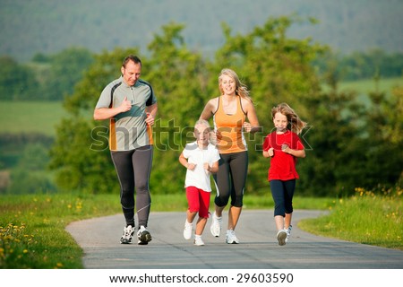Family jogging outdoors with the kids Family jogging outdoors with the kids