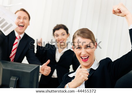 Business people having a lot of fun and letting it show, maybe they are lawyers looking at a favorable ruling, maybe they just got notice of their promotion