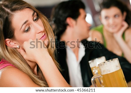 stock-photo-group-of-people-in-a-bar-or-restaurant-drinking-beer-woman-in-front-being-sad-since-her-boyfriend-45366211.jpg