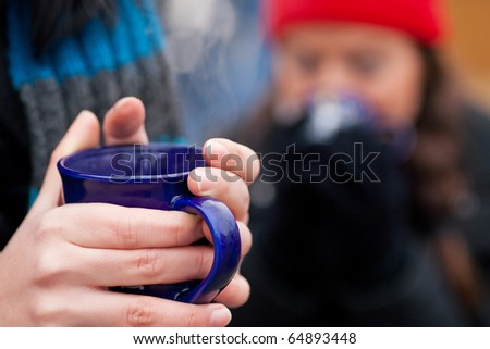 spiced wine color. stock photo : People on a Christmas market drinking punch or hot spiced wine