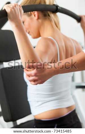 Patient at the physiotherapy making physical exercises