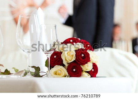 stock photo Wedding table at a wedding feast decorated with bridal bouquet