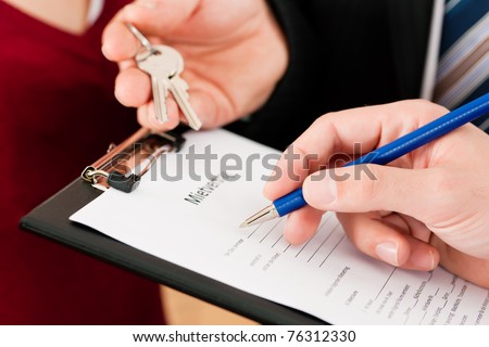 Rent an apartment - Signing tenant agreement; close-up on form