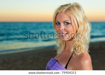 Woman in the sunset, wearing smart casual clothes
