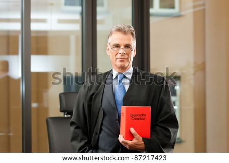 German Lawyer with civil law code in a court room