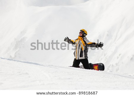 Snowboarder in the snow in winter, probably he is waiting for somebody
