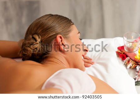 Wellness - woman getting massage in Spa; the therapist is using a glove