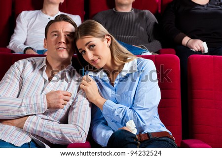 http://image.shutterstock.com/display_pic_with_logo/84610/84610,1328266041,10/stock-photo-couple-and-other-people-probably-friends-in-cinema-watching-a-movie-it-seems-to-be-a-romantic-94232524.jpg