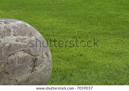Stone Sphere and Green Grass