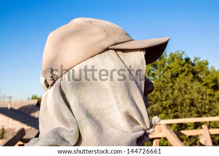 guest-worker at a construction site in caps