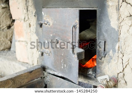 Old fireplace and door, stove, fire